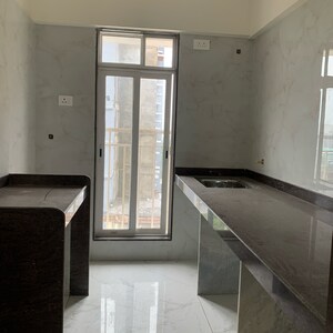 Kitchen in 2 BHK Apartment at Kosmos Kedar Darshan, Kastur Park – for Sale