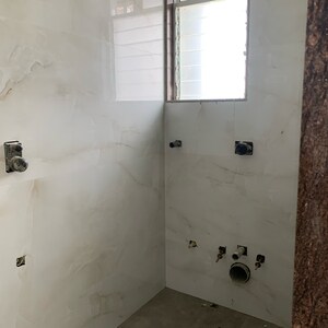 Bathroom in 2 BHK Apartment at Kosmos Kedar Darshan, Kastur Park – for Sale