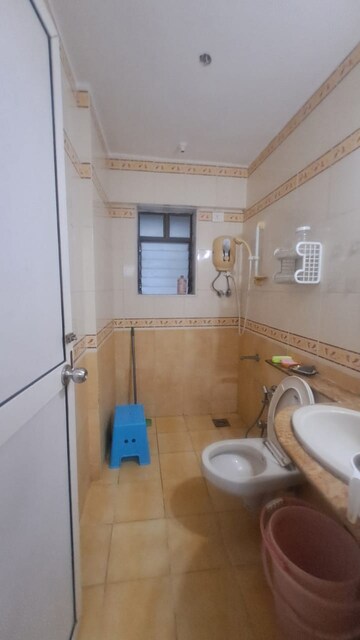 Bathroom in 2 BHK Apartment at Jasmine Tower, Vasant Vihar – for Rent