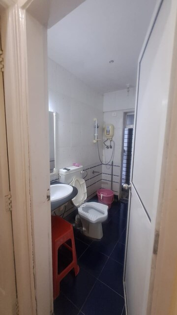 Bathroom in 2 BHK Apartment at Jasmine Tower, Vasant Vihar – for Rent