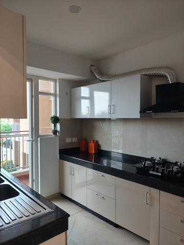 Kitchen in 5 BHK Apartment at Rishita Manhattan, Gomti Nagar – for Rent