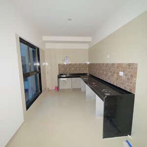 Kitchen in 4 BHK Apartment at Raj Infinia, Evershine Nagar – for Sale