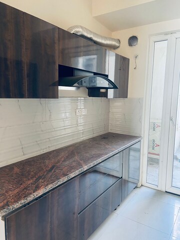 Kitchen in 4 BHK Apartment at Sunworld Arista, Sector 168 – for Rent