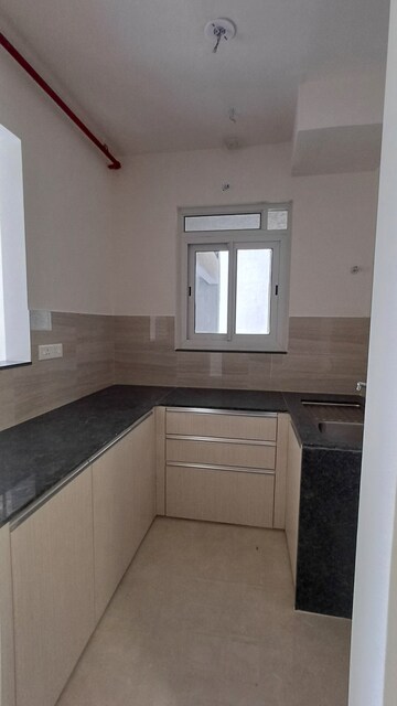 Kitchen in 2 BHK Apartment at Courtyard by Narang Realty and The Wadhwa Group, Pokhran Road No Two – for Rent