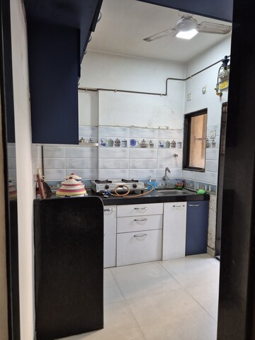Kitchen in 1 BHK Apartment at Kishor Sukur Enclave A, Ghodbunder Road – for Sale