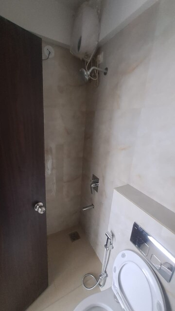 Bathroom in 1 BHK Apartment at Raymond Realty Phase II, Pokhran Road No Two – for Rent