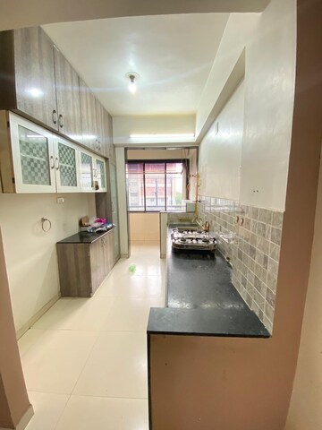 Kitchen in 2 BHK Apartment at Sahaj Solarium, Vasna – for Rent