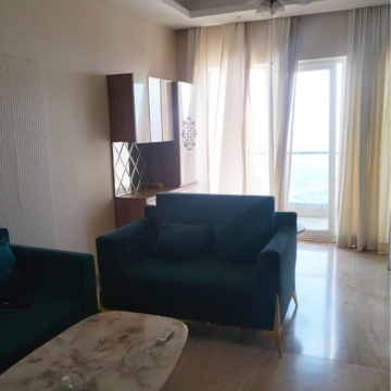 Living Room in 2 BHK Apartment at Supertech Supernova Nova Residences, Sector 94 – for Rent