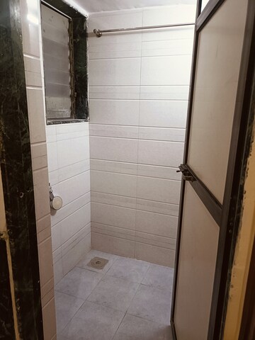 Bathroom in 1 BHK Apartment at Bajrangdas Bappa CHS, Dahisar East – for Rent