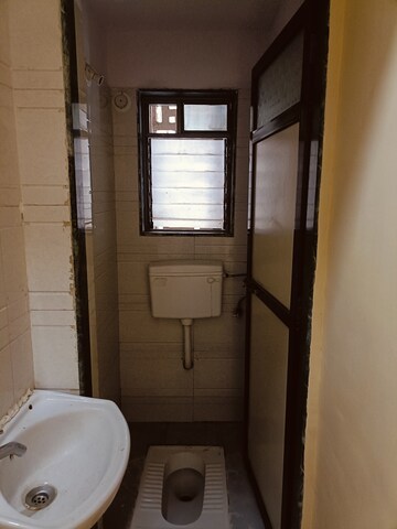 Bathroom in 1 BHK Apartment at Bajrangdas Bappa CHS, Dahisar East – for Rent