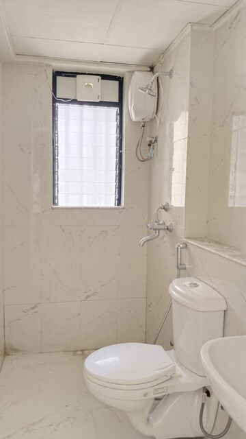 Bathroom in 1 BHK Apartment at Runwal Gardens, Dombivli East – for Rent