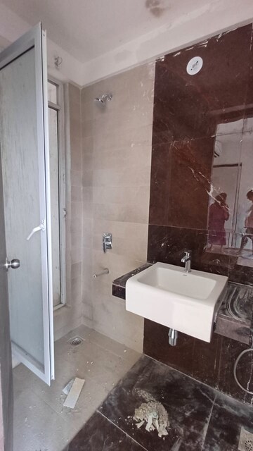 Bathroom in 1 BHK Apartment at Indiabulls One Indiabulls, Pokhran Road No Two – for Rent