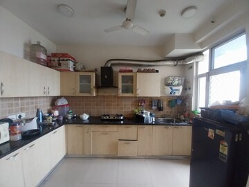 Kitchen in 2 BHK Apartment at Mahagun Mywoods, Sector 16c Greater Noida – for Rent