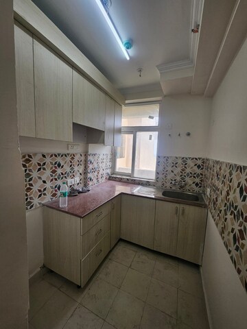Kitchen in 2 BHK Apartment at Amrapali Riverview, Amrapali Leisure Valley – for Rent
