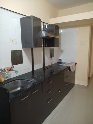 Kitchen in 2 BHK Apartment at Puranik City Reserva, Ghodbunder Road – for Rent