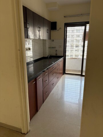 Kitchen in 2 BHK Apartment at Goyal Green Woods, Andheri East – for Rent