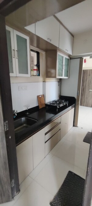 Kitchen in 1 BHK Apartment at Vijay Orovia, Ghodbunder Road – for Sale