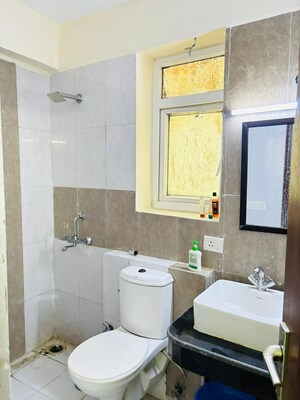 Bathroom in 3 BHK Apartment at Aims Golf City, Sector 75 – for Sale