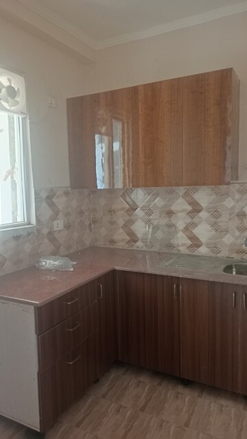 Kitchen in 2 BHK Apartment at Amrapali Golf Homes, Sector 4 Greater Noida – for Rent