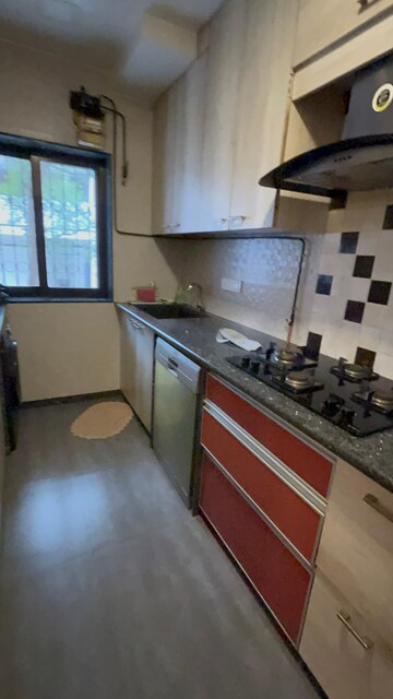 Kitchen in 2 BHK Apartment at Parijat CHS Andheri West, Yari Road – for Rent