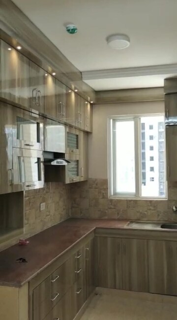 Kitchen in 3 BHK Apartment at Amrapali Golf Homes, Sector 4 Greater Noida – for Rent