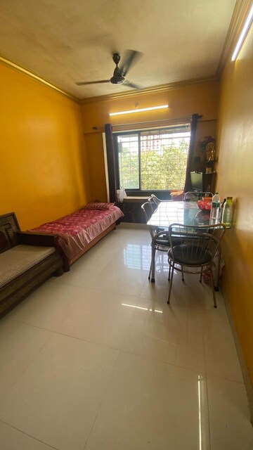 Living Room in 1 BHK Apartment at Divya Gunjan CHS, Kandivali West – for Sale