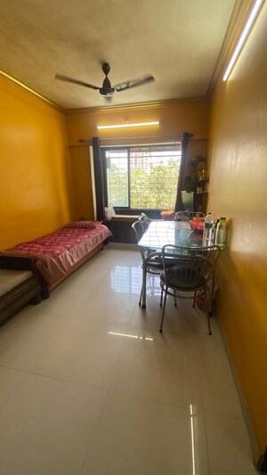 Living Room in 1 BHK Apartment at Divya Gunjan CHS, Kandivali West – for Sale