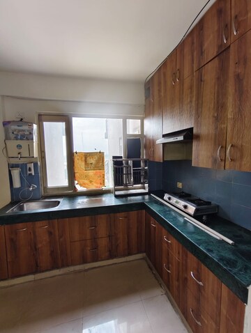 Kitchen in 2 BHK Apartment at ROF Aalayas, Sector 102 – for Rent