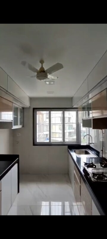 Kitchen in 3 BHK Apartment at Paranjape Schemes Royal Court, Andheri East – for Rent