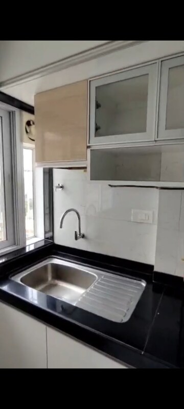 Kitchen in 3 BHK Apartment at Paranjape Schemes Royal Court, Andheri East – for Rent