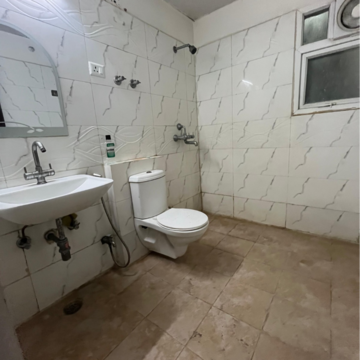 Bathroom in 3 BHK Apartment at Aims Golf City, Noida Central – for Rent