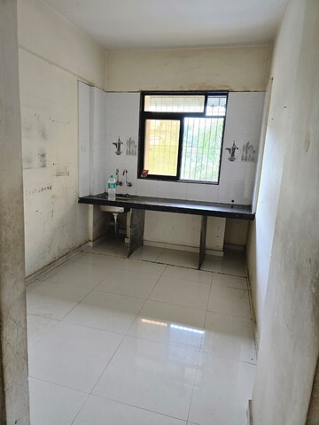 Kitchen in 2 BHK Apartment at Raj Tulsi Aanand, Badlapur East – for Rent
