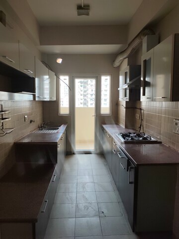 Kitchen in 3 BHK Apartment at Mahagun Moderne, Sector 78 – for Rent