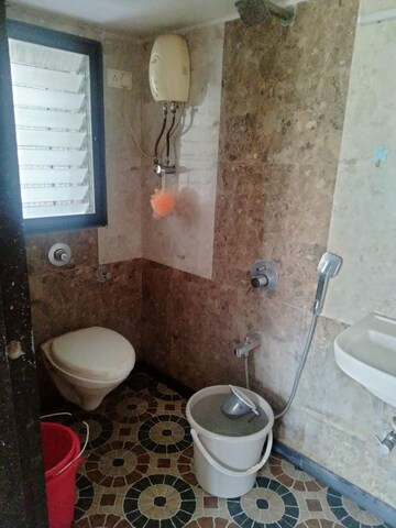 Bathroom in 2 BHK Apartment at Vile Parle East – for Sale