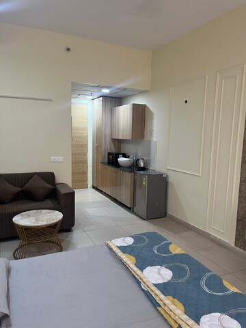 Living Room in Studio Apartment at Gaur City Center, Sector 4 Greater Noida – for Rent