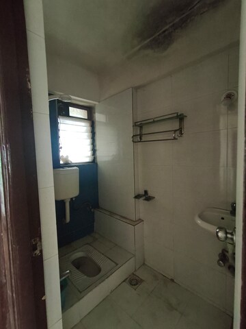 Bathroom in 1 BHK Apartment at Raunak Heights, Ghodbunder Road – for Rent