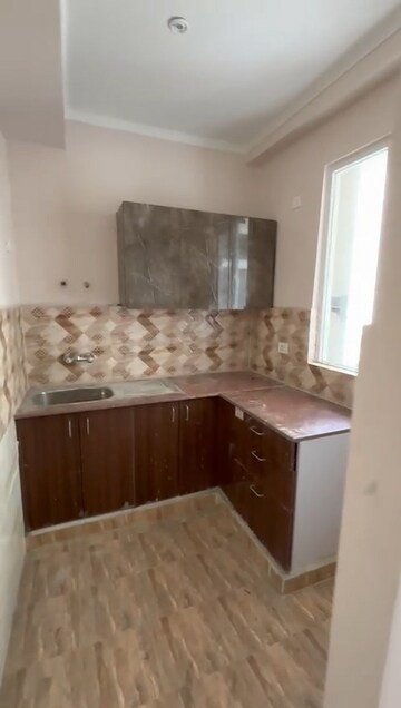 Kitchen in 2 BHK Apartment at Amrapali Golf Homes, Sector 4 Greater Noida – for Rent