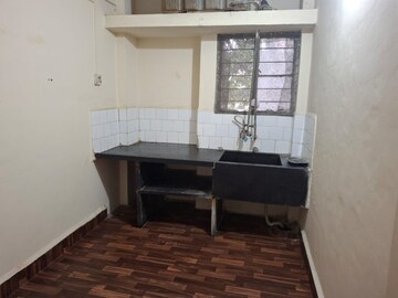 Kitchen in 1 BHK Apartment at Ganga Puram CHS, Viman Nagar – for Rent