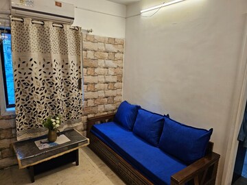 Living Room in 1 BHK Apartment at Juhu – for Rent