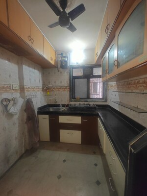 Kitchen in 1.5 BHK Apartment at Shreeji seva chs, Seawoods Sector 42 – for Sale