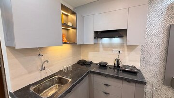 Kitchen in Studio Apartment at Okay Plus Solitaire Suites, Ramnagariya – for Rent