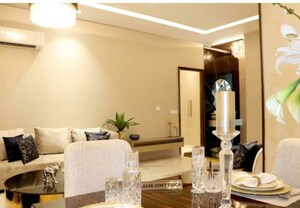 Living Room in 4 BHK Apartment at Artique Uptown Skylla, International Airport Road – for Sale