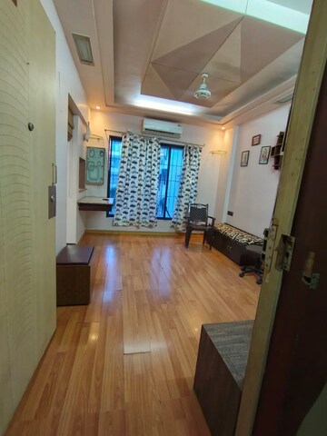 Living Room in Studio Apartment at Royal Palms, Goregaon East – for Rent