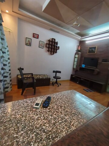 Living Room in Studio Apartment at Royal Palms, Goregaon East – for Rent
