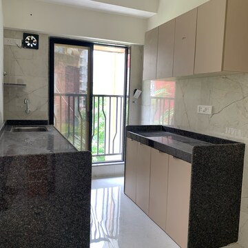 Kitchen in 2 BHK Apartment at Kamla Om Hansa CHS, Roshan Nagar – for Rent