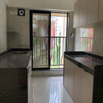 Kitchen in 2 BHK Apartment at Kamla Om Hansa CHS, Roshan Nagar – for Rent