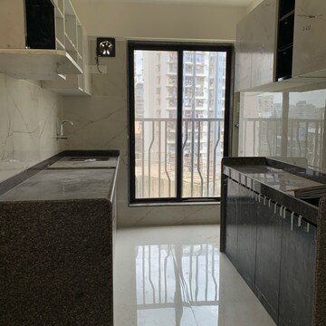 Kitchen in 2 BHK Apartment at Kamla Om Hansa CHS, Roshan Nagar – for Rent