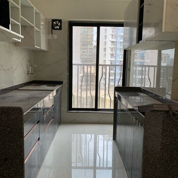 Kitchen in 2 BHK Apartment at Kamla Om Hansa CHS, Roshan Nagar – for Rent