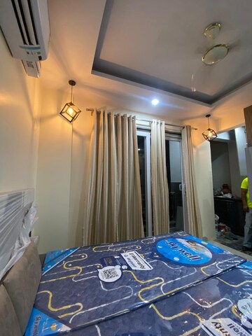 Bedroom in 4 BHK Builder Floor at Ansal API Esencia, Sector 67 – for Rent
