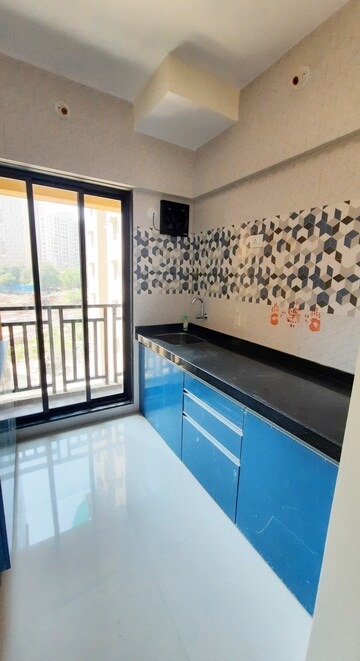 Kitchen in 1 BHK Apartment at Raunak Unnathi Woods Phase 7 A And B, Ghodbunder Road – for Rent